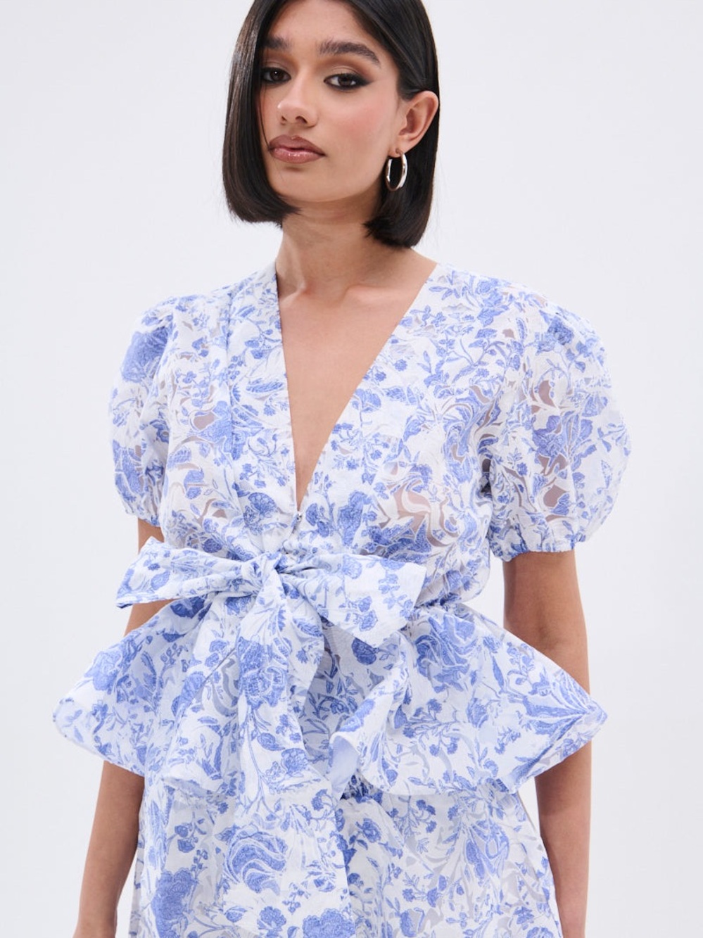AKIRA Blue and White Floral Tie-Front Peplum Blouse